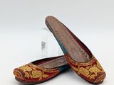 pair of women ' s red and gold slippers with floral design