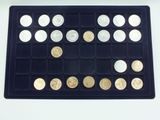 a tray with a lot of different coins in it