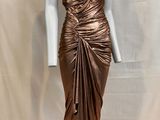 an image of a bronze dress on a mannequin base