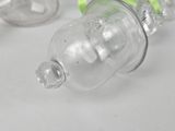 two empty water bottles sitting on a white surface