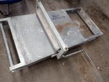 a metal table that has been placed on the ground