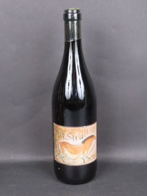 the bottle of wine is empty on the table
