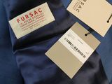 a label on a blue shirt that says fursac