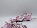 purple high heeled sandals with laces on the toes