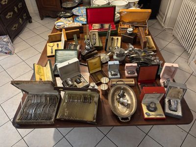 a table with a lot of silverware on top of it