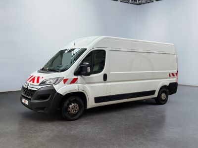 the white van is parked in the empty room of the building
