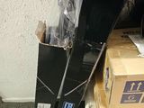 a pile of boxes and a pair of skis sitting on the floor