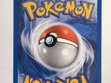 a close up of a pokemon card on a white surface