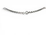 a close up of a chain on a white surface with a white background