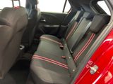 a red car with black seats in the back of it