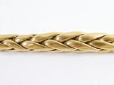 an image of a close up of a gold bracelet on a white surface