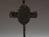 an old wooden cross with a bird on top of it