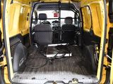 a yellow van that is parked in a parking lot