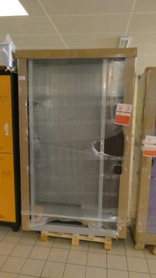 a refrigerator and a refrigerator freezer in the middle of a room