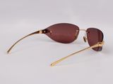 a close up of a pair of sunglasses on a white surface