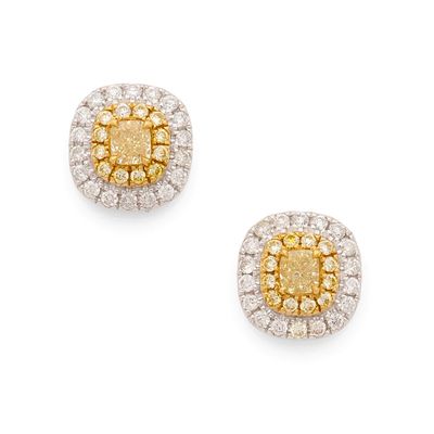 une paire de boucles d'oreilles en diamants jaunes et blancs
