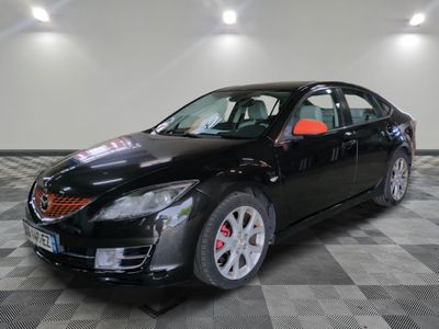 a picture of a black car that is on a checkered floor