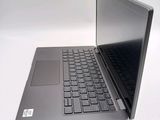a laptop that is open on a white surface