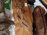 a lot of wood carvings on a table in a room
