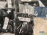 many different types of clothing on display in the store