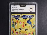 the pokemon card is in a clear plastic holder on a table