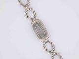 an image of a wrist watch with a chain around it