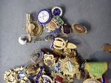 a lot of badges that are laying on the floor