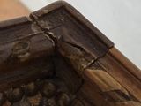 a close up of a piece of wood on the floor