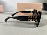 the sunglasses are black and have gold letters on them