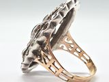 an image of a silver and gold ring on a white background