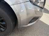 a close up of a car ' s tire on the side of the road