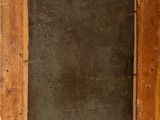 an old wooden picture frame with a black background in the middle