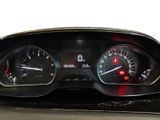 a close up of a car dashboard with various gauges