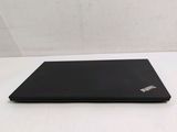a black laptop on a white table with a white background