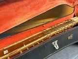 a guitar in a case sitting on the floor
