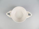 an image of a white bowl with blue and yellow designs on it