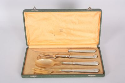 a green case with silverware in it on a white surface