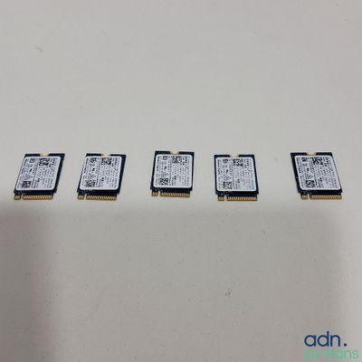 a close up of a row of four memory cards sitting on top of a table