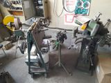 a machine that is sitting in a room with a lot of tools