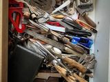 a drawer full of kitchen utensils and other kitchen tools