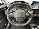 the interior of a car with a steering wheel and dashboard controls