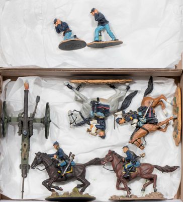 a box with a bunch of toy soldiers in it