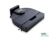 an image of a robotic vacuum cleaner on a white surface