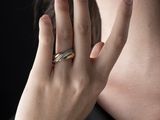 a woman with a ring on her finger and a ring on her hand