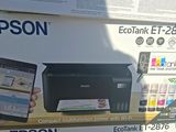 a box with a printer and a cell phone in it