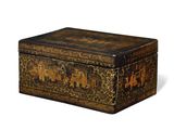 an old wooden box with a design of elephants on it