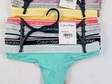 a close up of a group of underwear on a white surface