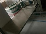 a table with a chair and a box on it