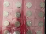 a lot of silver coins in a plastic case