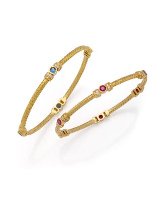 une paire de bracelets en or sertis de pierres multicolores
